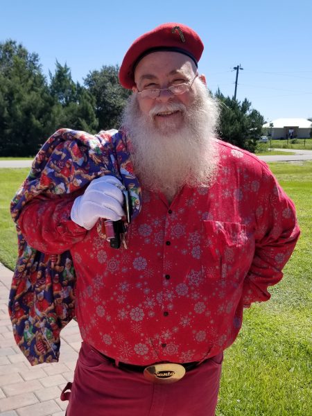 Friday's look: they asked me to come as Santa to hand out toys to the children. The ones who got flooded out with the storm surge had lost all their toys. Santa was a big hit with the little ones.