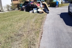 Sadly, this is how you know there is someone home: they are piling their lives on the curb. Yards with no wreckage are homes where the residents evacuated, or they are snowbirds who are not in the state yet.